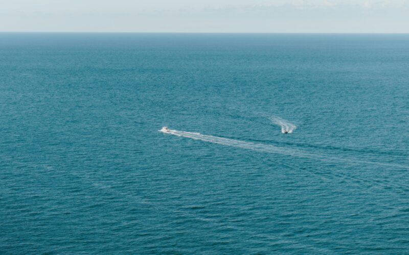 Indian Navy Tender Seeks One Surveillance Drone for Ernakulam Illustrative stock photograph of a small boat at sea; not the Indian Navy surveillance drone sought in the GeM tender.