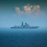Illustrative stock photograph of a grey naval vessel at sea; this is not INS Samarthak.